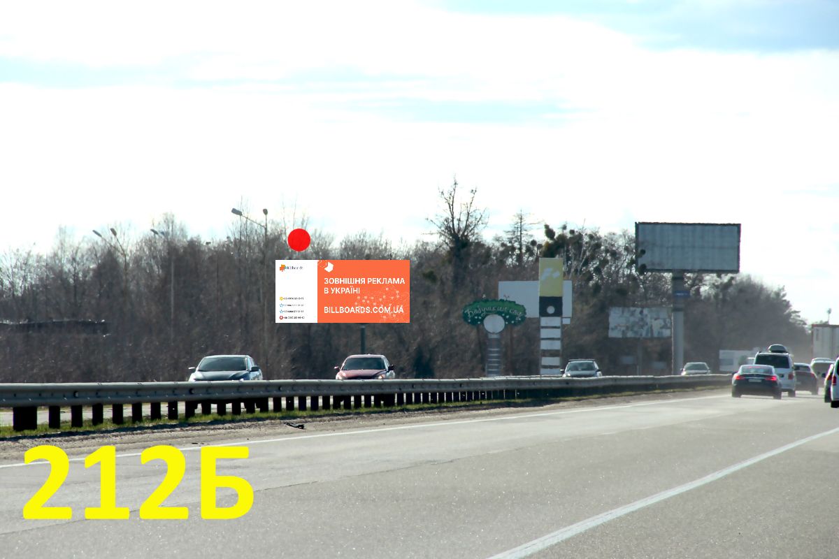 Billboard Parking,  A/d M-06 Kiiv-Zitomir 03; km 22+600 m, pravoruc / z Kieva, s. Stoanka (Zitomirs'ke sose), AZS Glusco, pered mostom-rozv'azkou na Irpin'; 1,7 km do KP (v'izd do Kieva)
