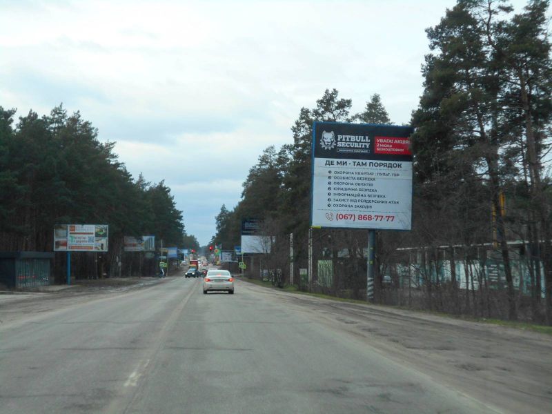 Billboard Bucha,  m. Buca, trasa M-07 "Kiiv-Kovel'", km 25+100 pravo, st. Sevcenka, v'izd v Bucu, ZK "Park Taun", navproti ofisu ZK "Na Proriznij", niz