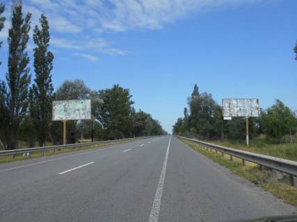 Billboard A in Nemishaeve smt. Nemisaevе, trasa M-07 "Kiiv-Kovel'", km 35+700 pravo, za 1.1km do povorotu na st. Central'na, za 1.4km do AZS BRSM Nafta, cerez 1.2km pisla povorotu na st. Parkova Photo 1