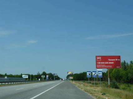 Billboard A in With. Mila с. Мила, траса М-06 "Київ-Чоп" (Житомир), км 27+050 право, через 300м після ресторану "Два бобра", за 350м до АЗС GLUSCO Photo 1
