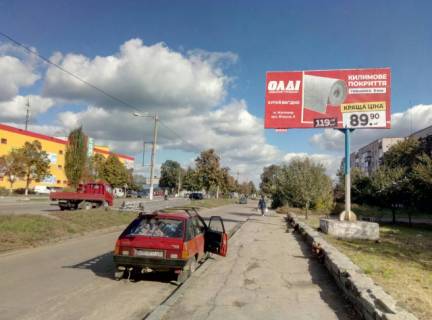 Billboard A in Korostishiv, 6x3  Korostisiv v. Kiivs'ka 103(GUS'̱), central'na st., napramok z Zitomira na Kiiv, naproti s/m "FURSET",st.A Photo 1