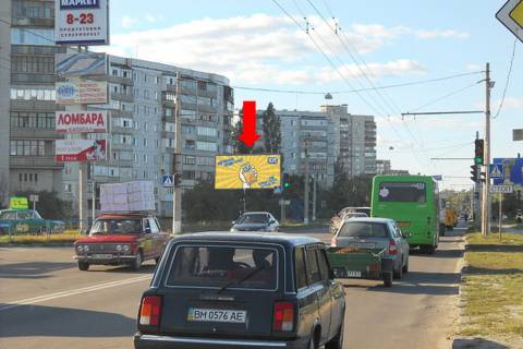 Billboard B in Sumi, 3x6  Geroiv Krut st. (kol. Cerepina st.) / Sirka st. (kol. Korotcenka st.), bila supermarketu "Ekomarket" Photo 1