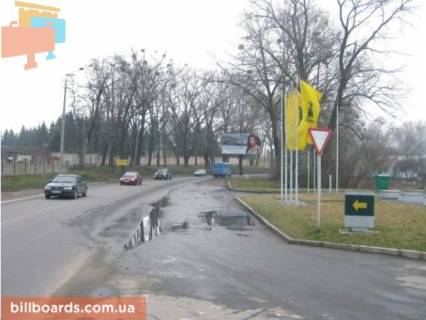 Billboard A in Rivne Cornovola st., bila AZS "OKKO", viizd z mista Photo 1