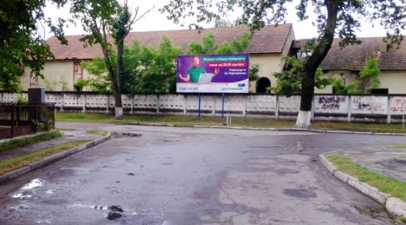 Billboard A in Zhovkva, 6x3м.  m. Zovkva, st. UPA, 14 (stadion, osadbank, viddilenna likarni, pensijnij fond) Photo 1