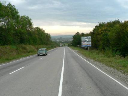 Billboard A in Nadvirna, 3x6  Trasa Ivano-Frankivs'k-Bogorodcani-Nadvirna, na v`izdi u Nadvirnu z Bogorodcan, napramok ruhu na Nadvirnu, Aremce, Bukovel' (niz) Photo 1