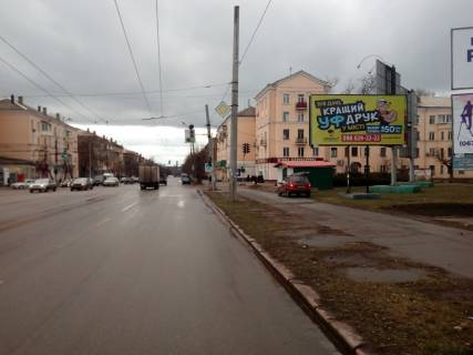 Billboard A in Krivy Rig perehresta  st. Elektricnoi ta st. Serzanta Rzankina. KRES. Napramok ruhu do Pioneru. Sirokij oglad plosi cerez prospekt ta z zupinok mis'kogo transportu. Photo 1