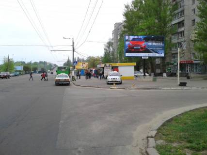 Billboard A in Zhytomyr, 6x3  Miru prosp., 37 (Mikrorajon DOS, "EKO-market", apteka "Pervocvit-Farm", PRODMARKET "Prospekt", OsadBank), v napramku centra mista Photo 1