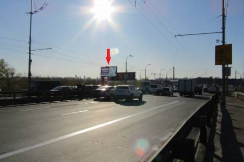Billboard B in Kyiv, 5.7x2.8  Banderi Stepana prosp., Pivnicnij (Moskovs'kij) mist(zizd z mostu), (METRO, Blokbaster, "OKKO", Vinner Avtomotiv, TC "Plazma"), v napramku Tul's'ka plosa Photo 1