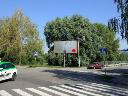 Billboard B in Khmelnitsky, 3*6  st.Pribuz'ka, v rajoni mostu na "Epicentr" ta TRC "Oazis". nepodalik:  "Epicentr", TRC "Oazis", supermarket "TavriaV" ta "Sil'po", bezlic dribnih magaziniv ta komercijnih ob'ektiv (centr) [vid centru, do Epicentru] Photo 1