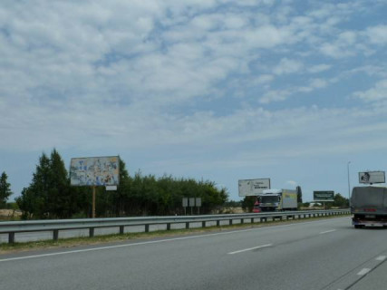 Billboard B in With. Mila, 6х3  с. Мила, траса М-06 "Київ-Чоп" (Житомир), км 27+050 право, за 300м до ресторану "Два бобра", через 350м після АЗС GLUSCO Photo 1