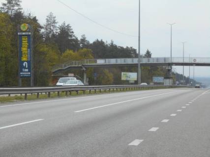 Billboard B in Kapitanivka, 6х3  s. Kapitanivka, trasa M-06 "Kiiv-Cop" (Zitomir), km 24+100 pravo, povorot na Bucu, avtobusna zupinka Kapitanivka, cerez 720m pisla AZS AMIC Photo 1