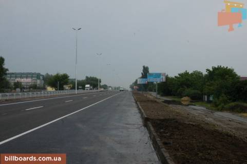 Billboard A in With. Mila, 6х3  s. Mila, trasa M-06 "Kiiv-Cop" (Zitomir), km 26+200 livo, pered povorotom na s. Petruski, navproti restoranu "Kozacok", magazin "Fora" Photo 1