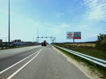 Billboard A in With. Mila, 6х3  s. Mila, trasa M-06 "Kiiv-Cop" (Zitomir), km 26+700 pravo, za 650m pered  AZS GLUSCO, navproti restoranu "Dva bobra" Photo 1