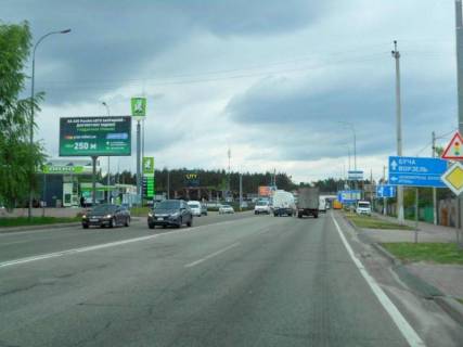 Billboard B in Gostomel, 6х3  м. Гостомель-м. Ірпінь, вул. Шевченка-вул. Свято- Покровська (навпроти №10), перетин з вул. Гайдамацька, траса М-07, км 23+550 ліво, біля АЗК ОККО, Сіті Маркет Photo 1