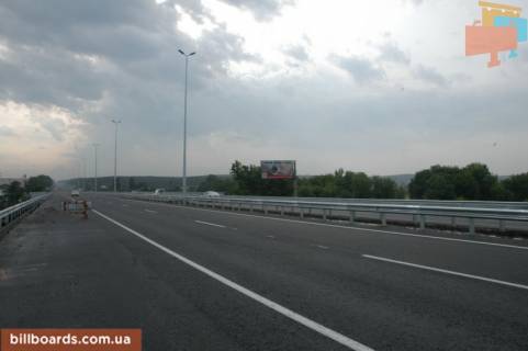 Billboard A in Parking, 6х3  s. Stoanka, trasa M-06 "Kiiv-Cop" (Zitomir), km 21+100 pravo, mist cerez r. Irpinka, do rozvilki Irpin'-Gorenici Photo 1