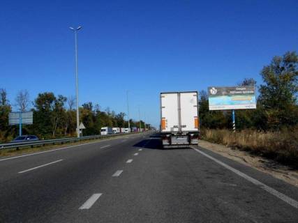 Billboard A in Kopiliv, 6х3  с. Копилів, траса М-06 "Київ-Чоп" (Житомир), км 45+020 ліво, митні склади, завод "Ruukki", після ресторану "Шашличний Двір", Київська Регіональна Митниця Photo 1