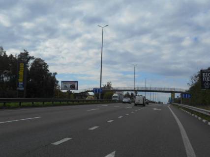 Billboard B in Kapitanivka, 6х3  s. Kapitanivka, trasa M-06 "Kiiv-Cop" (Zitomir), km 24+120 livo, pered povorotom na Bucu, avtobusna zupinka Kapitanivka Photo 1