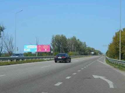Billboard B in Obukhiv, 12х3  Dniprovs'ke sose, trasa N-01 "Kiiv-Znam'anka", km 43+000 pravo, cerez 100m pisla rozv'azki na m. Obuhiv ta m. Ukrainka, viizd z m. Obuhiv v storonu m. Kiiv, livij Photo 1