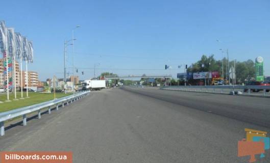 Billboard A in Khodosivka, 12х3  Dniprovs'ke sose, trasa N-01 "Kiiv-Znam'anka", km 23+650 livo, povorot na s. Hodosivku, bila AZS UPG, cerez 150m pisla TC "MegaMarket", livij Photo 1