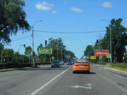 Billboard A in Bucha, 6х3  m. Buca, trasa M-07 "Kiiv-Kovel'", km 30+000 pravo, st. Nove Sose, bila TC Modul', povorot na parkovku magazinu Epicentr, cerez 400m pisla TRC Avenir Plaza, za 150m do AZS WOG Photo 1