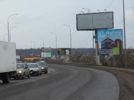 Billboard A in Irpin m. Irpin', trasa M-07, km 23+400 livo, st. Svato-Pokrovs'ka, 2a, pered mostom cerez r. Irpinka, navproti ofisu ZK "Gostomel' Rezidens", cerez 150m pisla AZS OKKO, verh Photo 1