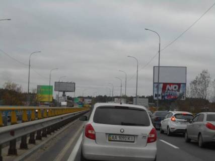 Billboard A in Irpin m. Irpin', trasa M-07, km 23+200 pravo, mist cerez r. Irpinka, v'izd u misto, za 375m do AZS OKKO, cerez 400m pisla magazinu ATB, cerez 450m pisla magazinu FORA, verh Photo 1
