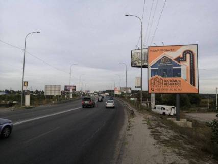 Billboard A in Irpin m. Irpin', trasa M-07, km 23+400 livo, st. Svato-Pokrovs'ka, 2a, pered mostom cerez r. Irpinka, navproti ofisu ZK "Gostomel' Rezidens", 150m za AZS OKKO, verh Photo 1