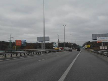 Billboard B in Parking s. Stoanka, trasa M-06 Kiiv-Cop (Zitomir), km 21+100 pravo, mist cerez r. Irpinka, v'izd v m. Kiiv, 350m do AZS Marshal Photo 1