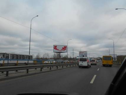 Billboard B in Irpin m. Irpin', trasa M-07, km 23+150 pravo, mist cerez r. Irpinka, viizd z mista, cerez 425m pisla AZS OKKO Photo 1