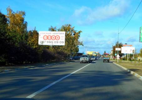 Billboard B in Gostomel, 6х3  смт. Гостомель, вул. Свято-Покровська, 3-А, навпроти повороту на вул. Вербицького, перед Алеєю Слави, перед Ринком Photo 1