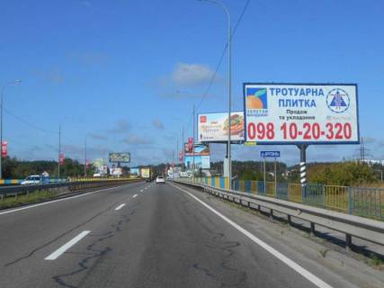 Billboard A in Irpin, 6х3  m. Irpin', trasa M-07 "Kiiv-Kovel'", km 23+125 pravo, mist cerez r. Irpinka, v'izd u misto, za 450m do AZS OKKO Photo 1