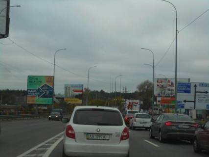 Billboard B in Irpin m. Irpin', trasa M-07, km 23+400 livo, st. Svato-Pokrovs'ka, 2a, za mostom cerez r. Irpinka, navproti ofisu ZK "Gostomel' Rezidens", za 350m do rozvilki Irpin'-Buca-Gostomel', za 150m do AZS OKKO, verh Photo 1