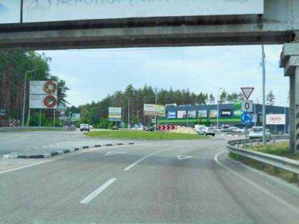 Billboard B in Irpin, 6х3  m. Irpin', trasa M-07 "Kiiv-Kovel'", km 23+875 livo, st. Svato-Pokrovs'ka, 24A, rozvilka Irpin'-Gostomel'-Buca, na svitlofori, ZK "Druzi", pered povorotom na Gostomel', napramok na Bucu, verh Photo 1