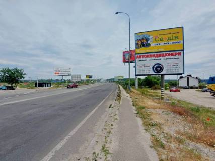 Billboard A in Irpin, 6х3  m. Irpin', trasa M-07 "Kiiv-Kovel'", km 23+400 livo, st. Svato-Pokrovs'ka, 2a, pered mostom cerez r. Irpinka, navproti ofisu ZK "Gostomel' Rezidens", cerez 150m pisla AZS OKKO, niz Photo 1
