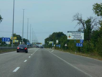 Billboard A in Kopiliv, 6х3  с. Копилів, траса М-06 "Київ-Чоп" (Житомир), км 45+000 право, митні склади, завод "Ruukki", перед рестораном "Шашличний Двір", Київська Регіональна Митниця Photo 1