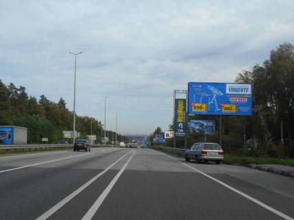 Billboard A in Kapitanivka, 6х3  s. Kapitanivka, trasa M-06 "Kiiv-Cop" (Zitomir), km 24+120 livo, pered rozvorotom na Bucu, avtobusna zupinka Kapitanivka Photo 1